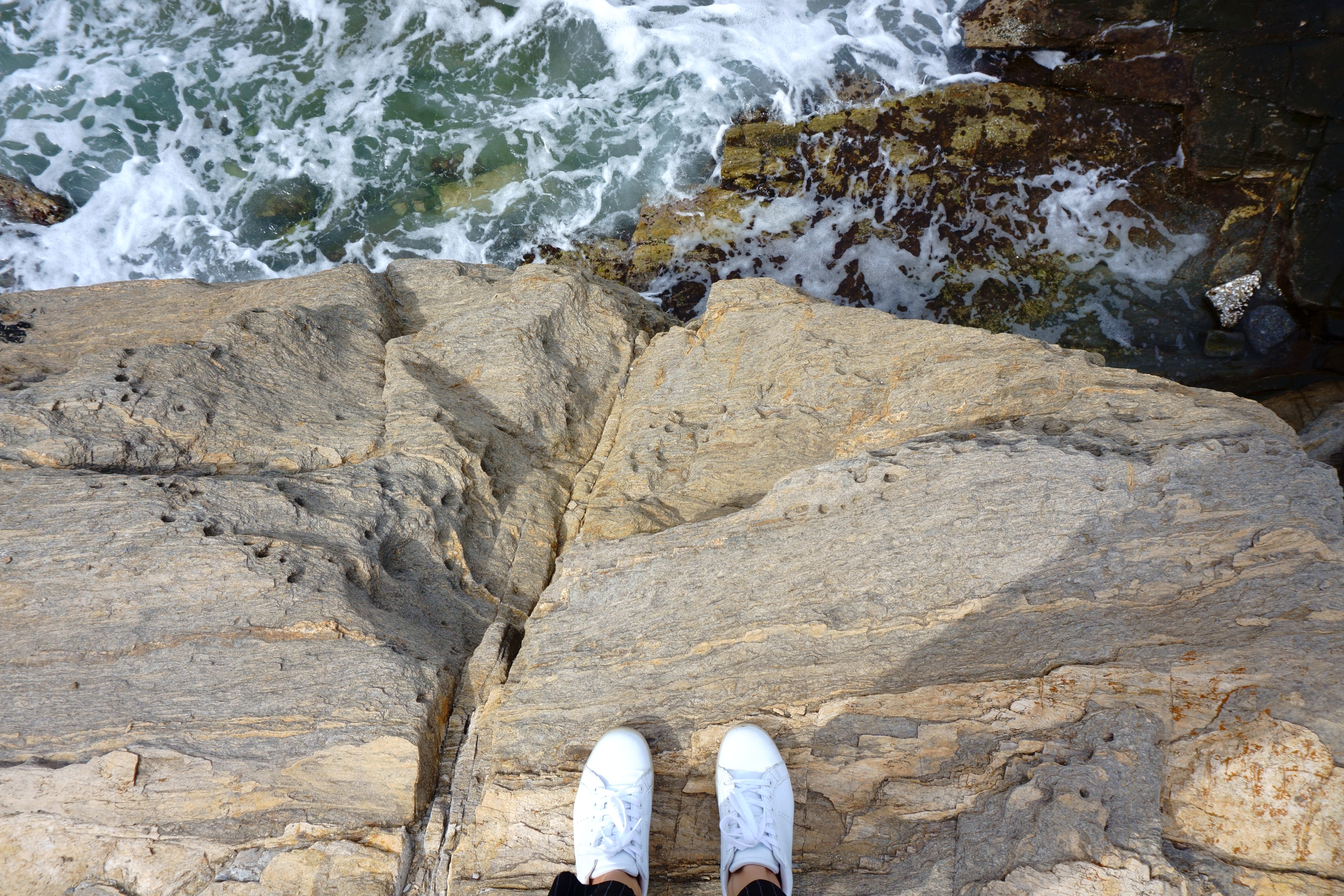 Shoes overlooking ocean